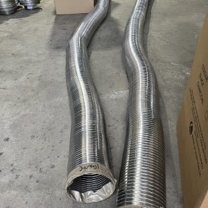 Two large metal ventilation ducts on warehouse floor.