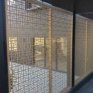Decorative metal privacy screen with geometric pattern