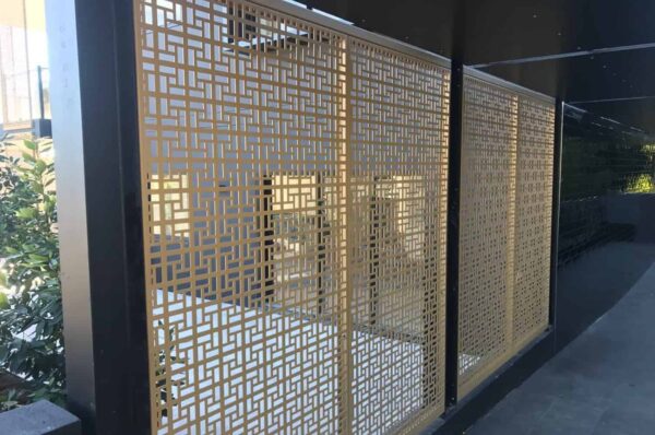 Decorative metal privacy screen with geometric pattern
