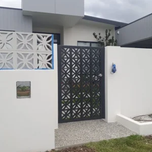 Modern home with decorative gate and white wall