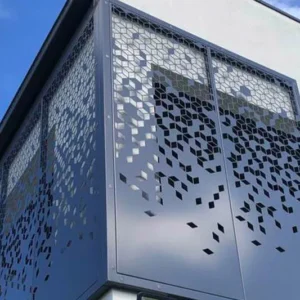 Decorative metal screen on modern building exterior.