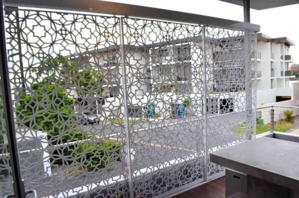 Decorative panel with geometric pattern on balcony.