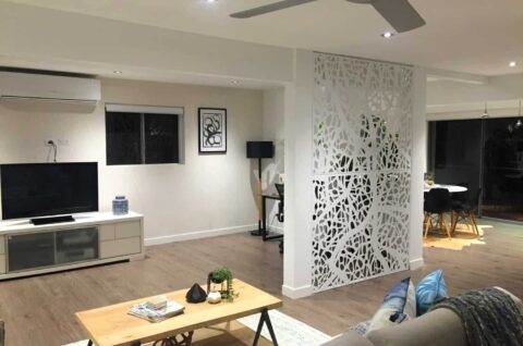 Modern living room with decorative partition panel.