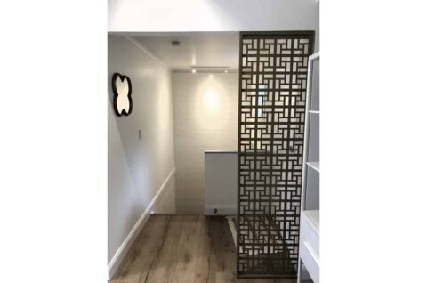 Modern hallway with geometric screen divider