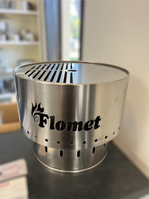 Flomet stainless steel stove with ventilation slots.