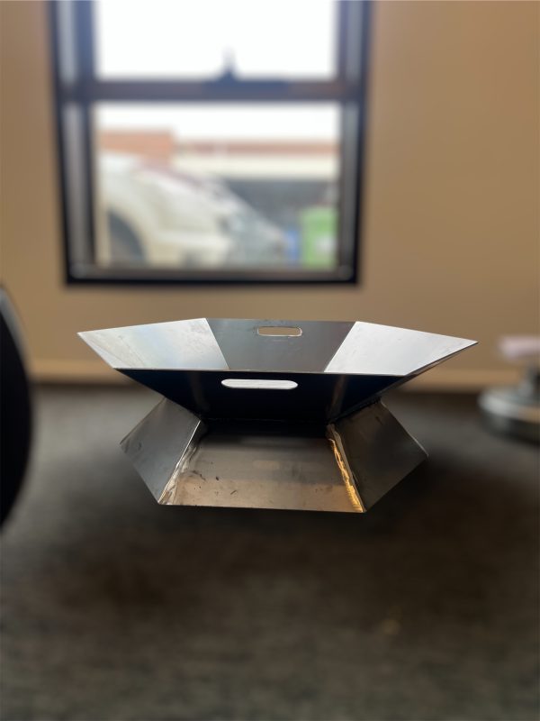 Metal charcoal burner in indoor setting