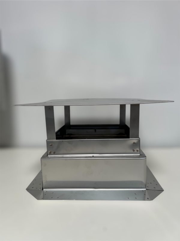 Stainless steel exhaust hood on display table.
